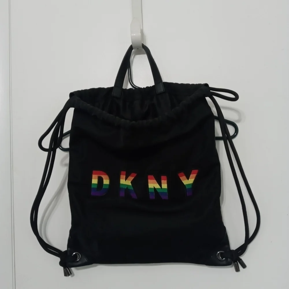 DKNY RAISED RAINBOW LETTER HEAVYWEIGHT DRAWSTRING BACPACK W MULTIPLE POCKETS